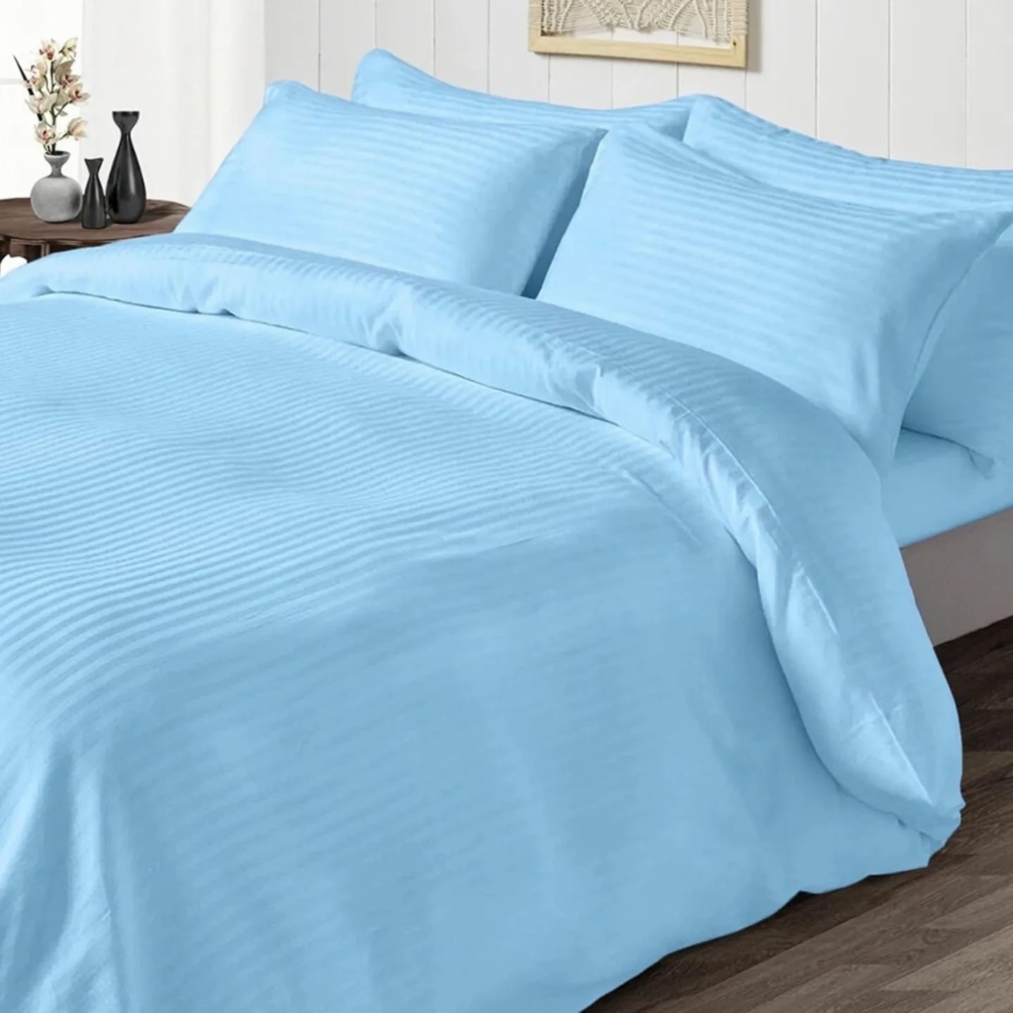bedding set light blue with stripes king size on bed