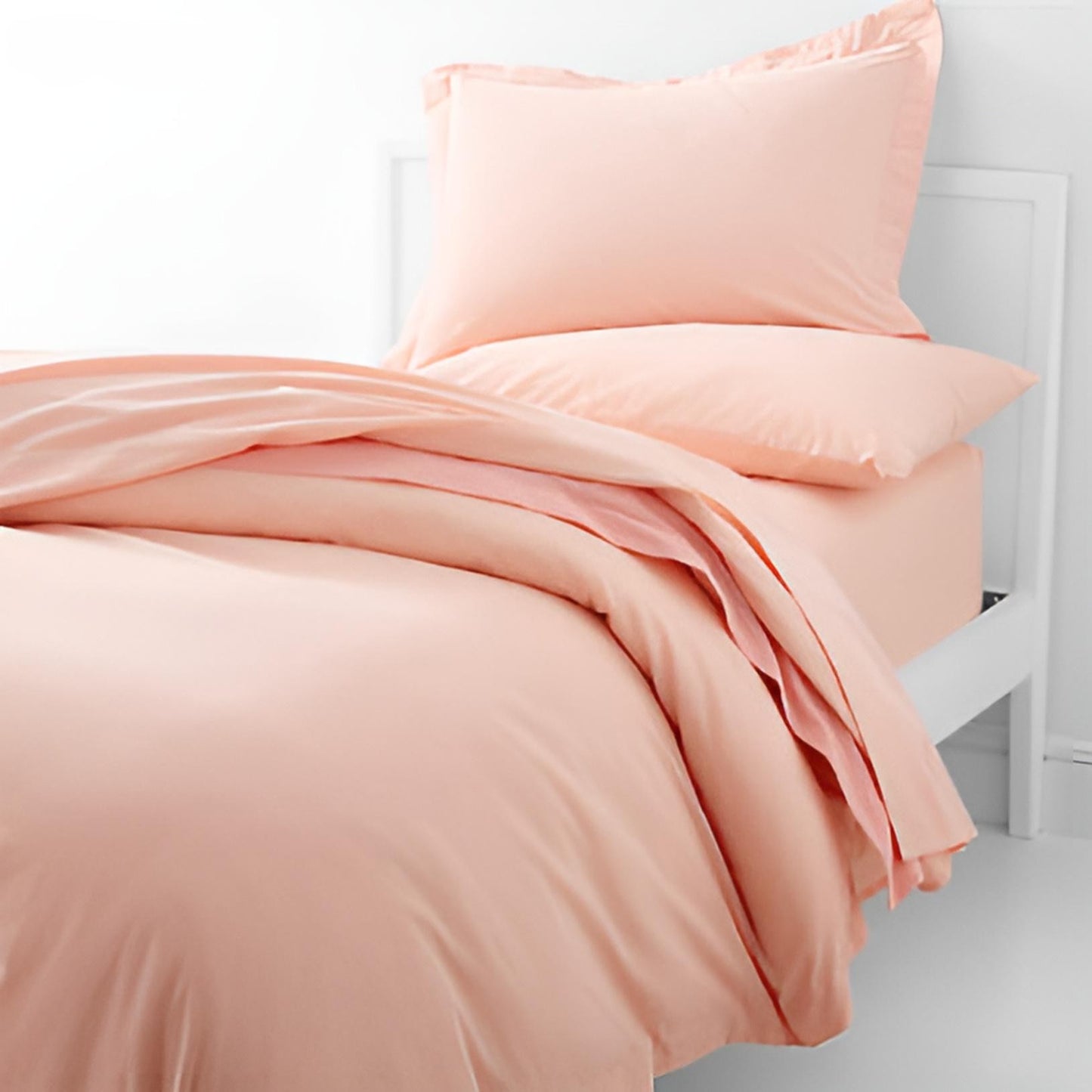 peachy pink bedding set king size on bed