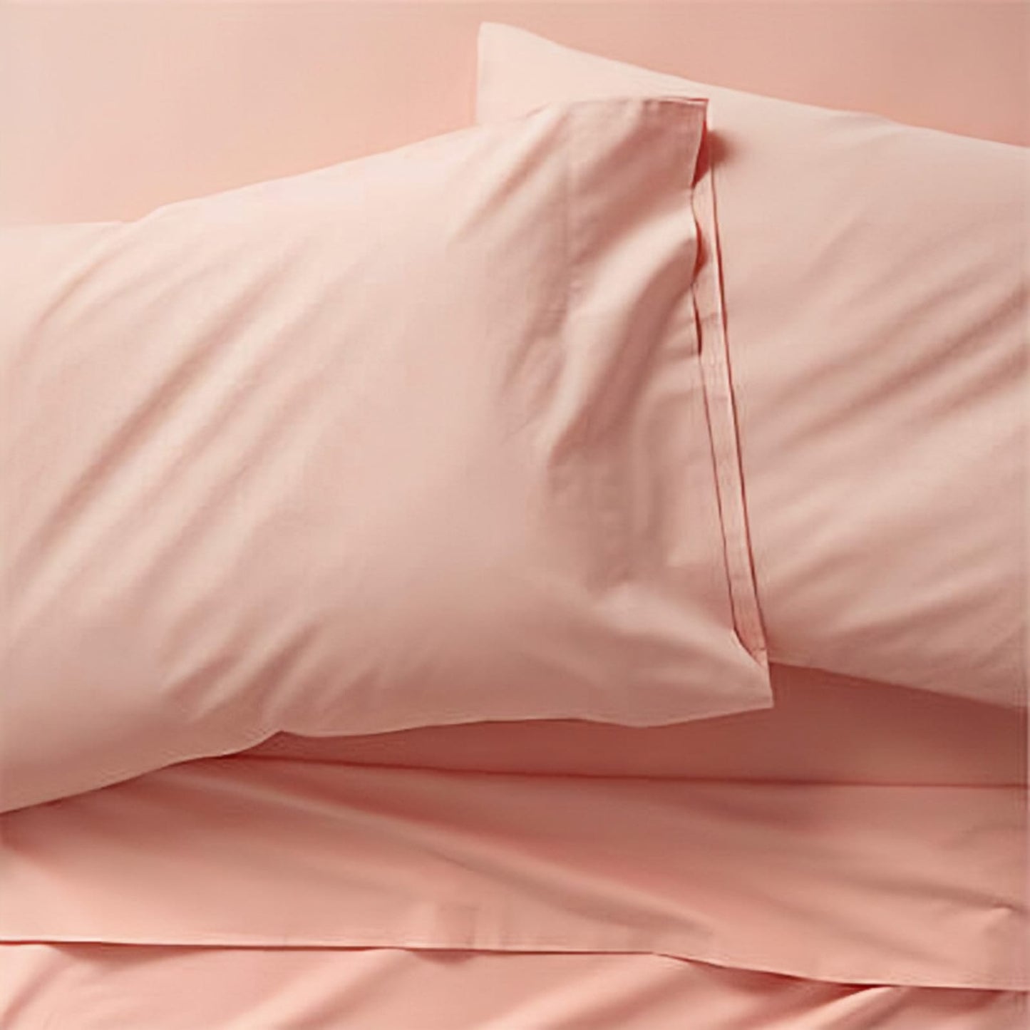 peachy pink pillow casses on pillows