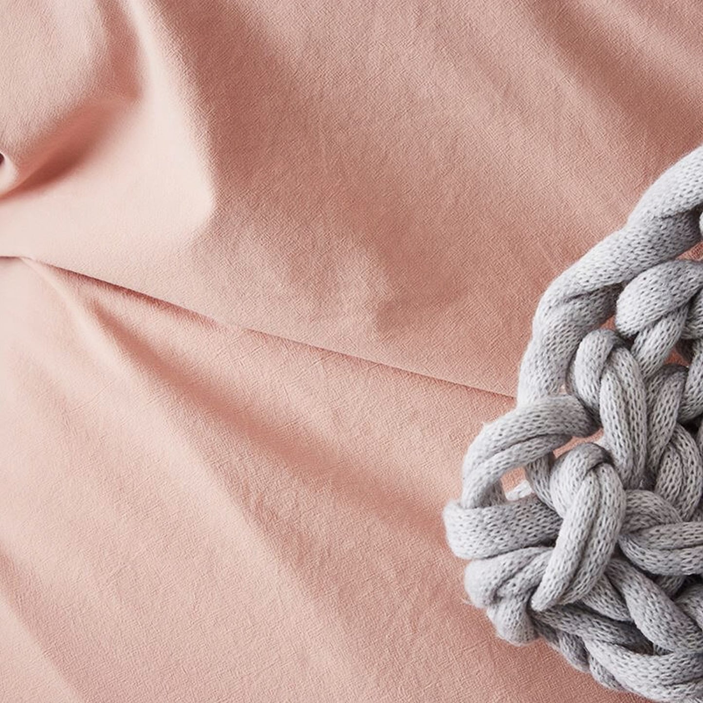 peachy pink material of bedding set