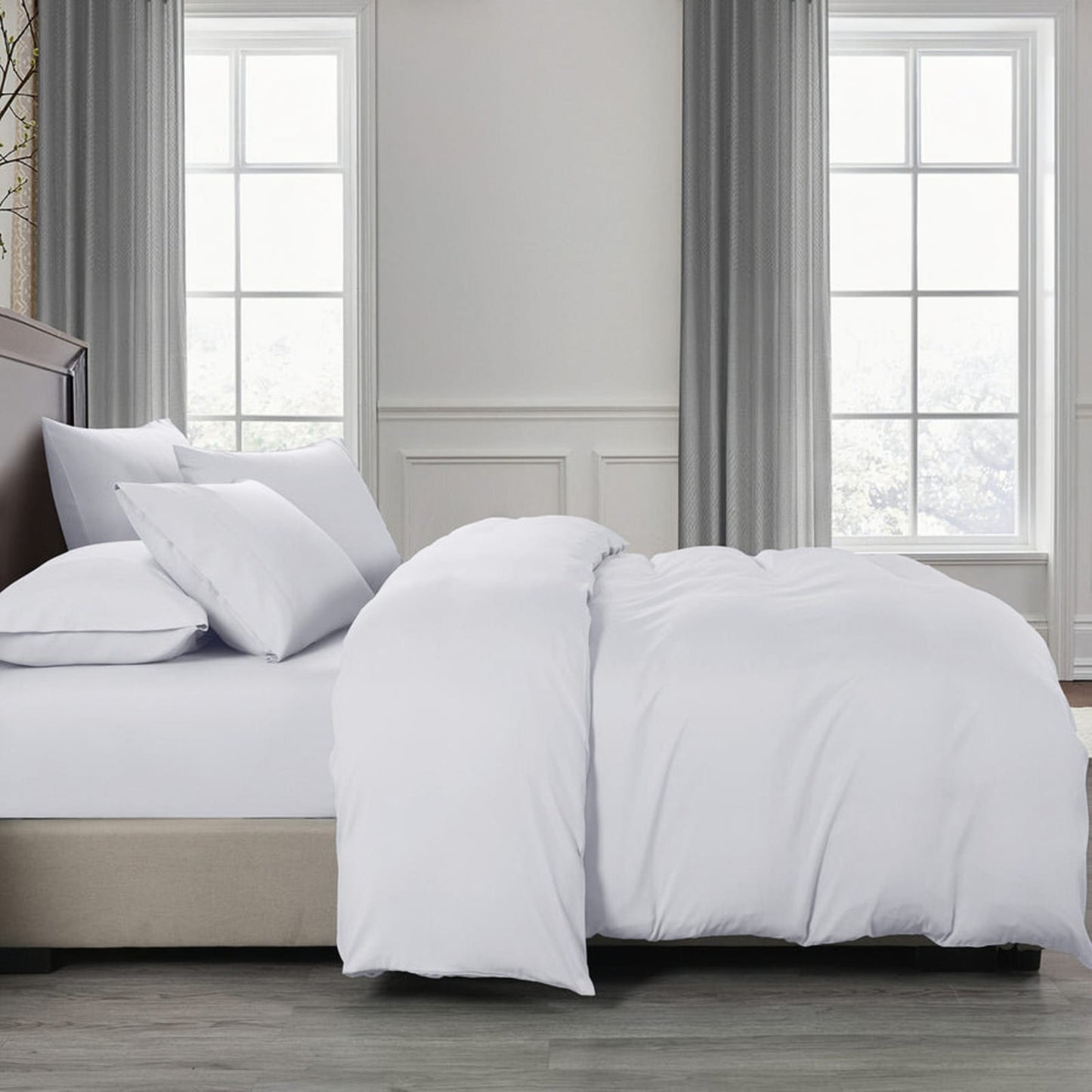 white cotton bedding set on bed