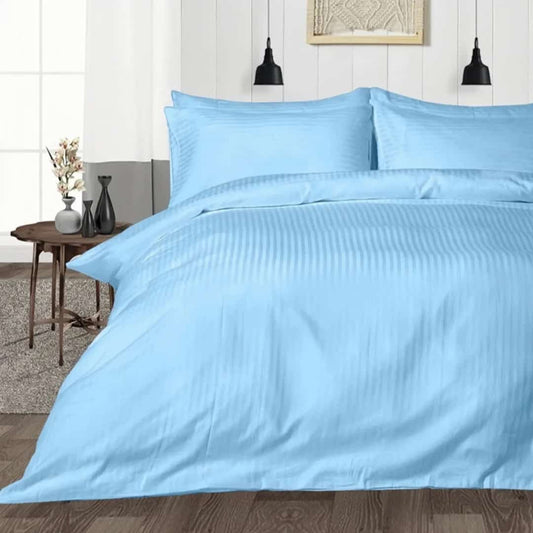 bedding set light blue with stripes king size on bed