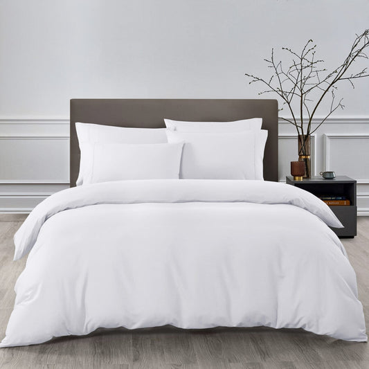 white cotton bedding set on bed