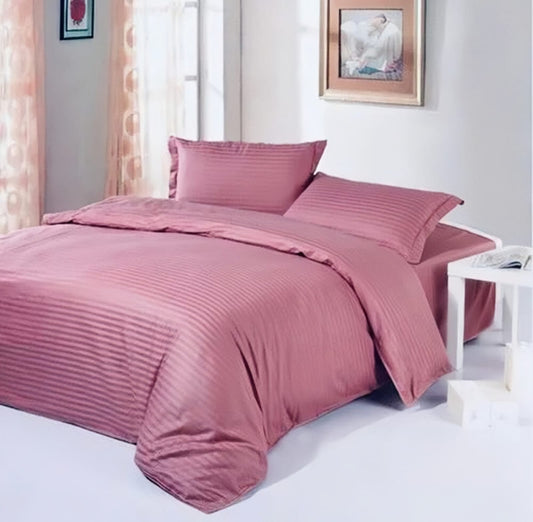 purple bedding set with stripes on bed